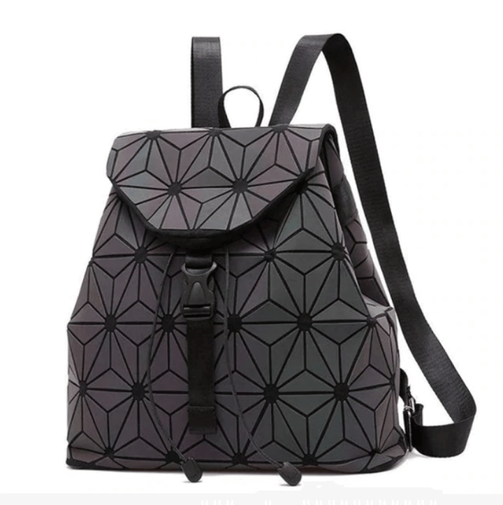 Close-up of luminous geometric pattern on a women's reflective color-changing backpack.