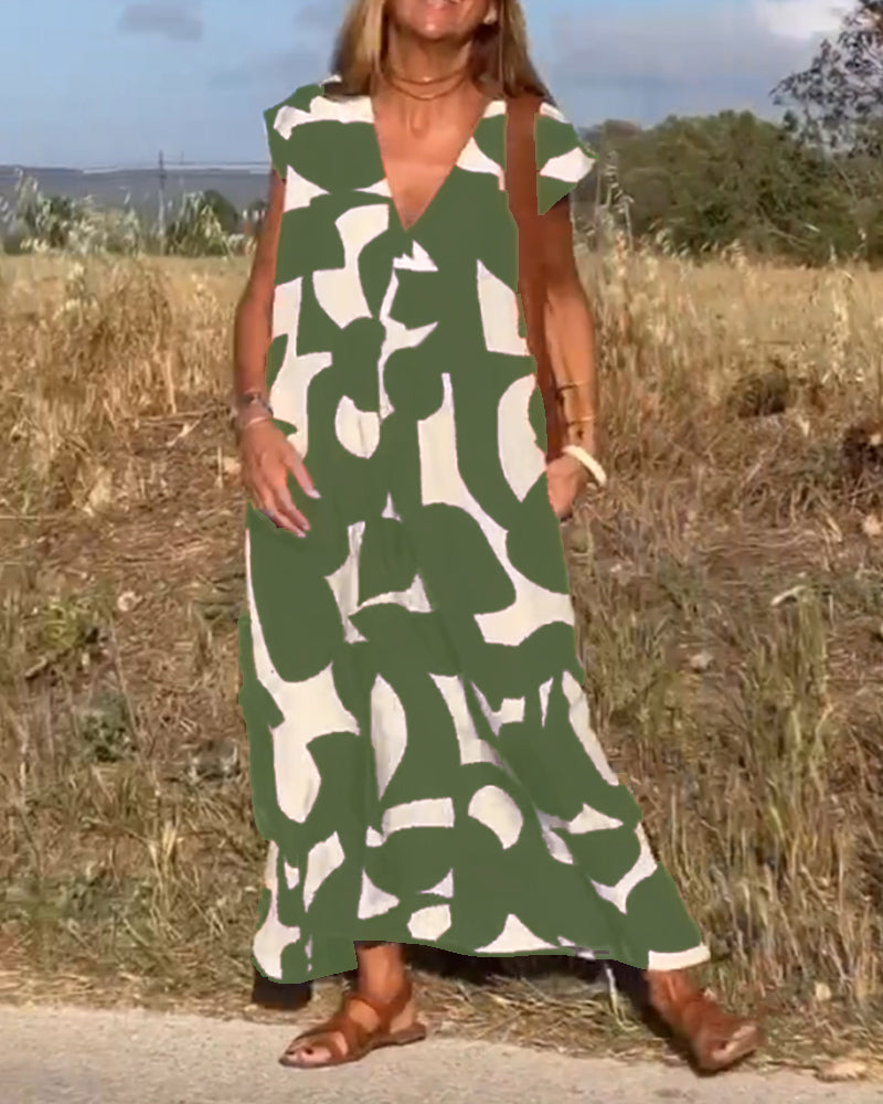 Relaxed abstract summer dress for women. Stylish, flowy, with V-neck & cap sleeves for comfort.