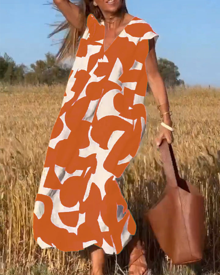 Women's relaxed abstract print dress. Flowy, stylish, V-neck. Ideal for summer casual wear.