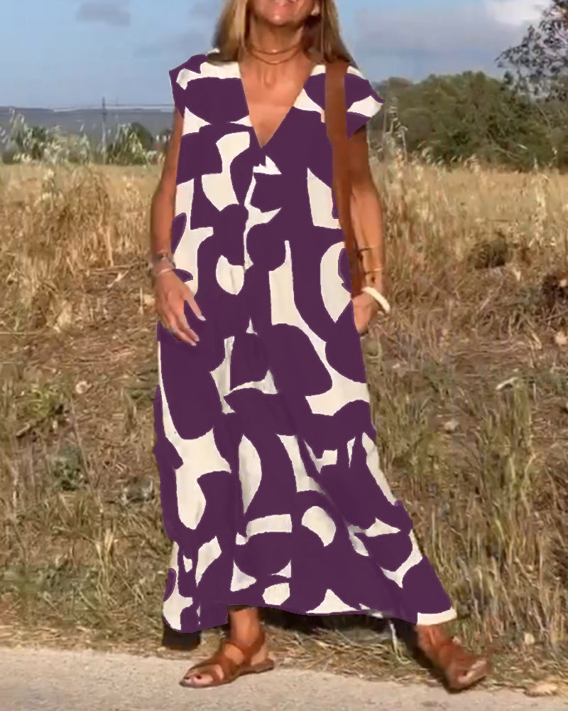 Modern women's abstract summer dress. Flowy, cap sleeve, relaxed fit. Comfortable fashion statement.