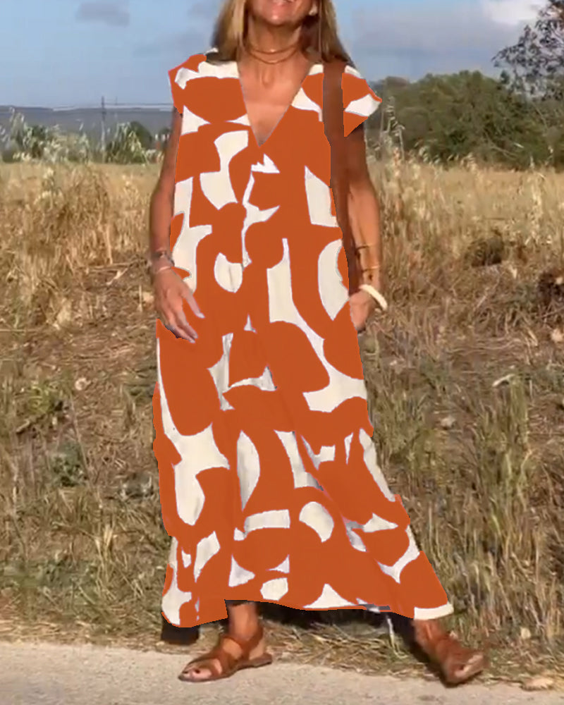 Women's flowy abstract vacation dress. Relaxed fit, V-neck. Comfortable & stylish summer wear.