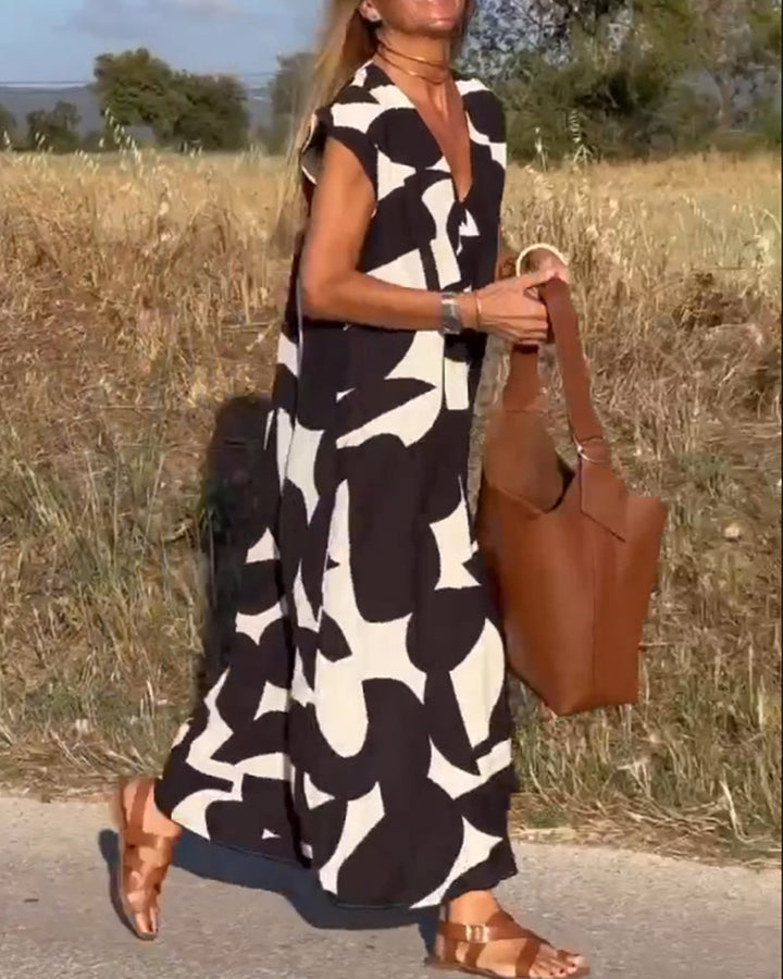 Abstract print women's dress, relaxed flowy fit. Stylish summer vacation wear, modern aesthetic.