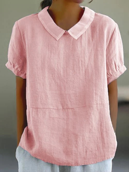 Light blue women's Peter Pan collar blouse. Relaxed fit, short sleeve casual top for everyday wear.