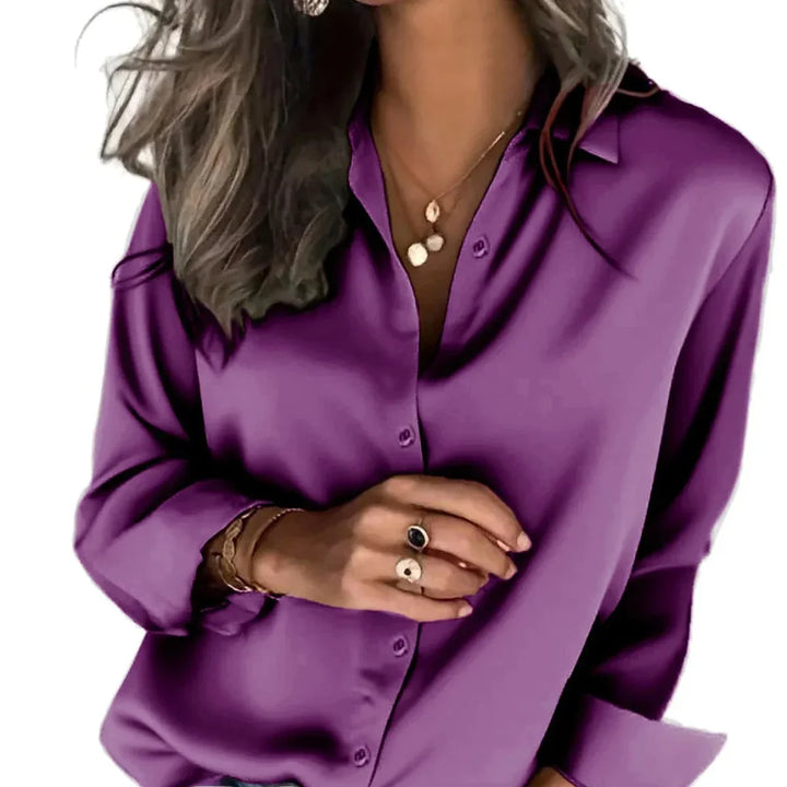 Women's relaxed fit button-down shirt, long sleeve, stylish & comfortable for versatile wear.