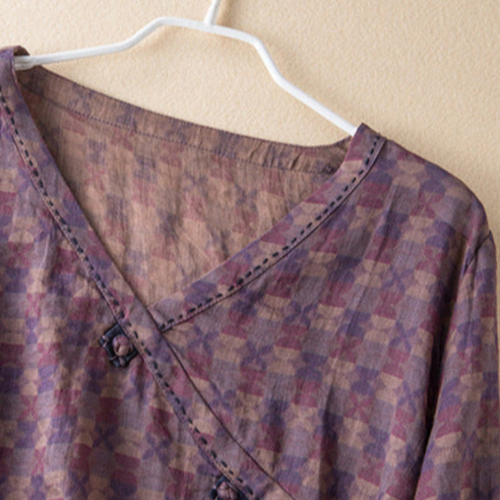 Elegant women's button-front blouse with roll-up sleeves. Relaxed fit for spring & summer style.