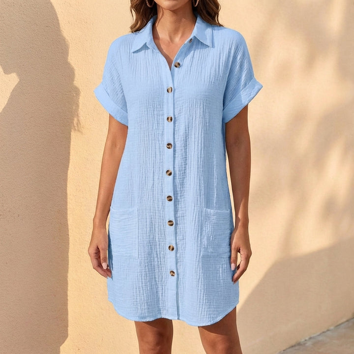 Casual women's relaxed fit midi shirt dress with cuffed sleeves, ideal for comfortable summer wear.