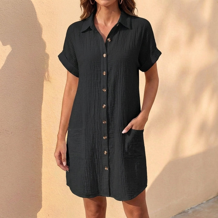Stylish green button front midi shirt dress for women. Features relaxed fit and cuffed sleeves.
