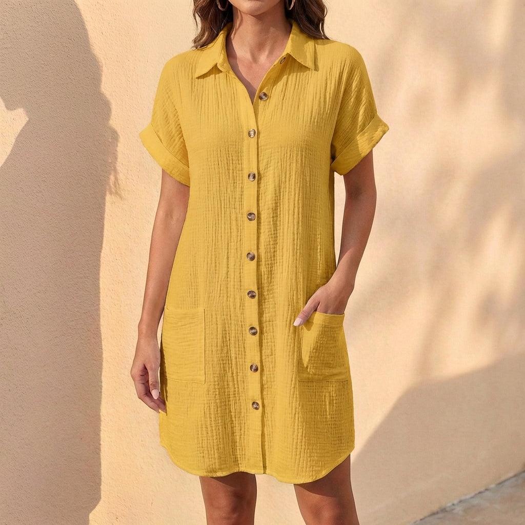 Chic black relaxed fit midi dress with button front & cuffed sleeves. A versatile collared everyday dress.