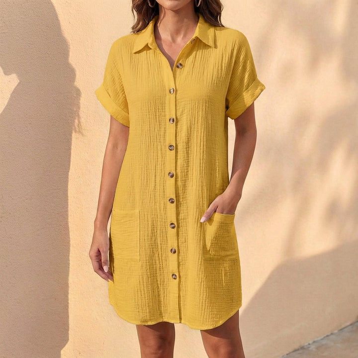 Chic black relaxed fit midi dress with button front & cuffed sleeves. A versatile collared everyday dress.