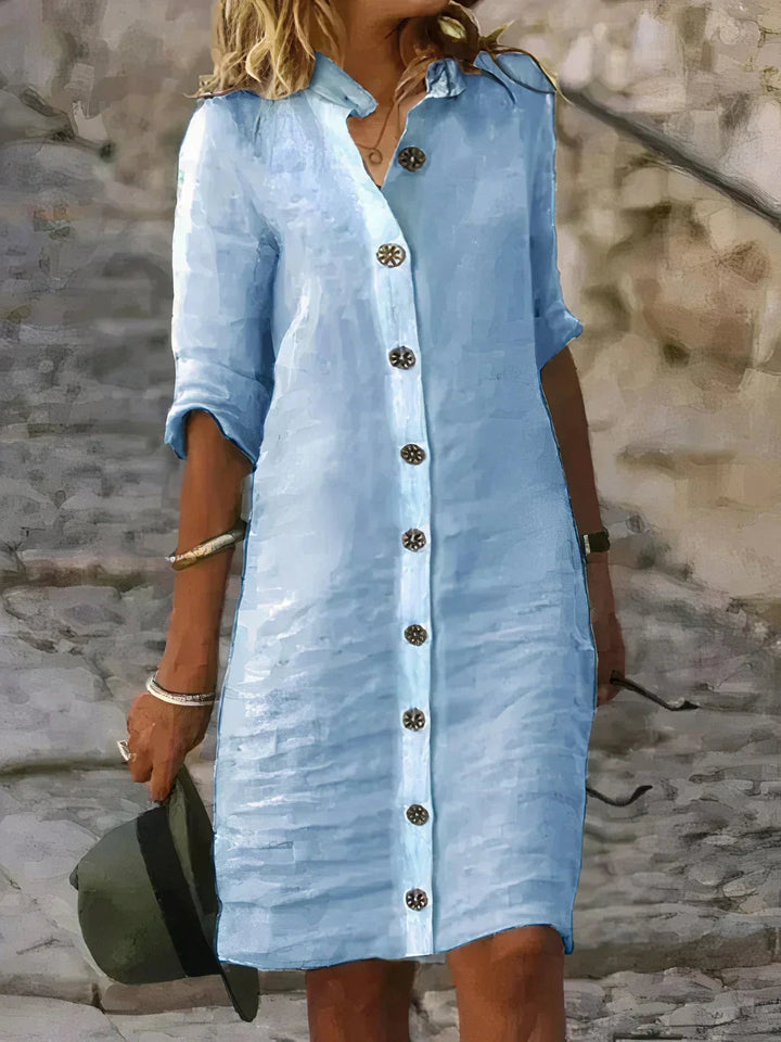 Women's relaxed fit button-up midi dress. Perfect for casual summer style or versatile day wear.