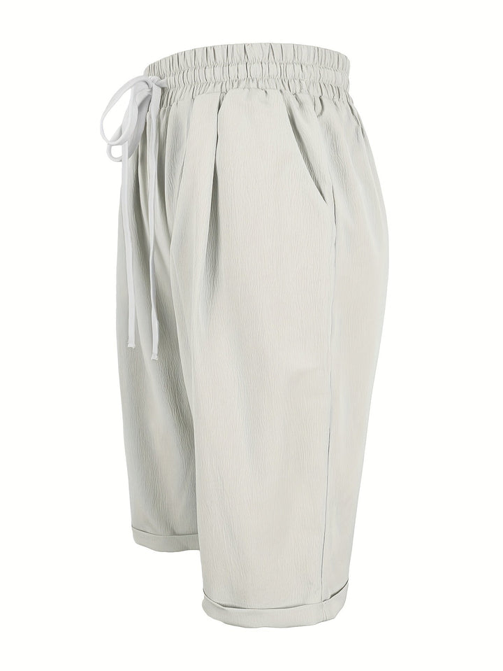 Pull-on women's capri trousers, relaxed fit, elastic waist, lightweight & comfortable mid-calf pants.