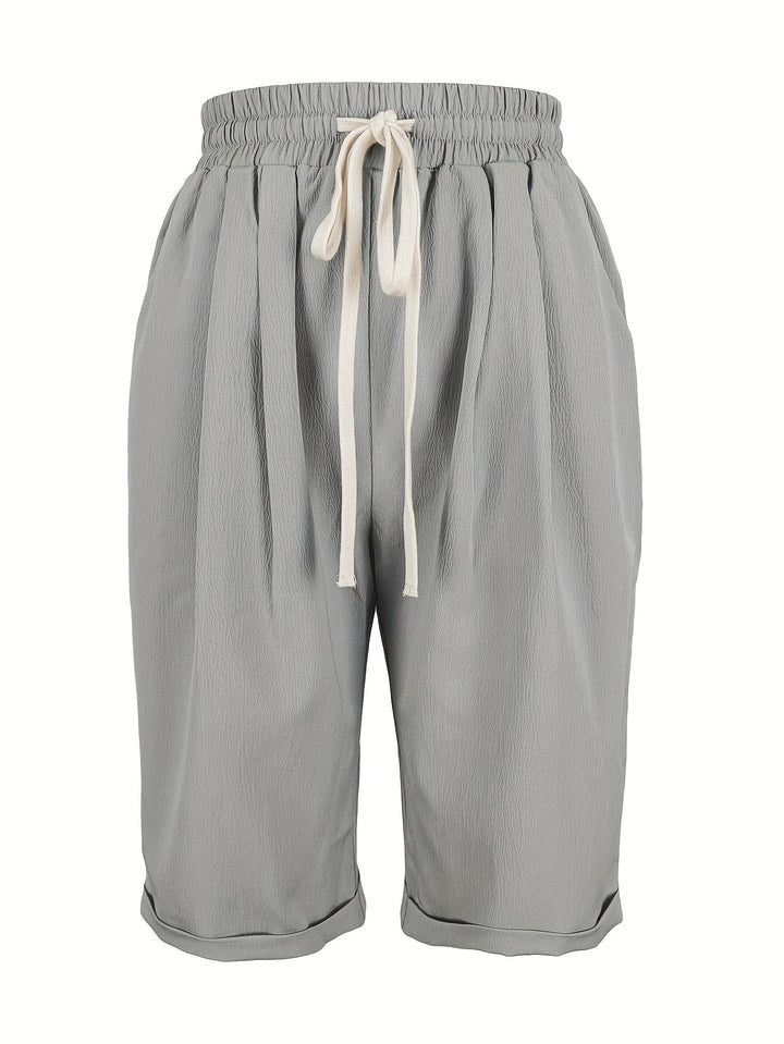 Women's lightweight mid-calf capri trousers, relaxed fit, elastic waist, pull-on for casual comfort.