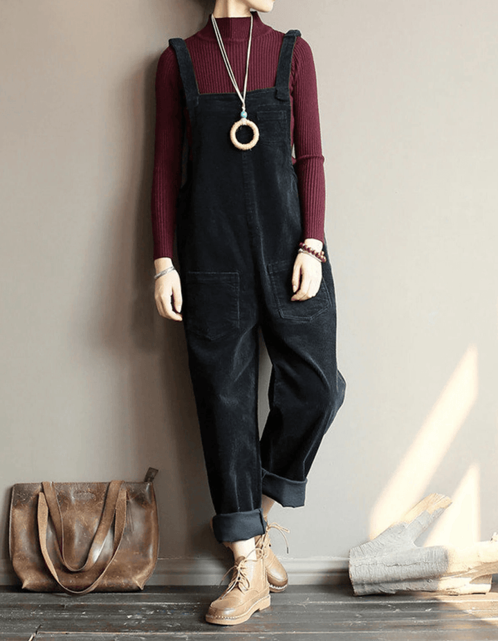 Effortless women's wide-leg dungaree jumpsuit for comfortable everyday style. Features adjustable straps & patch pockets.