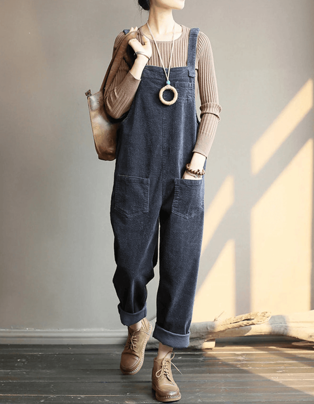Comfortable women's relaxed fit dungaree overall jumpsuit. Stylish wide-leg design with adjustable straps for casual wear.