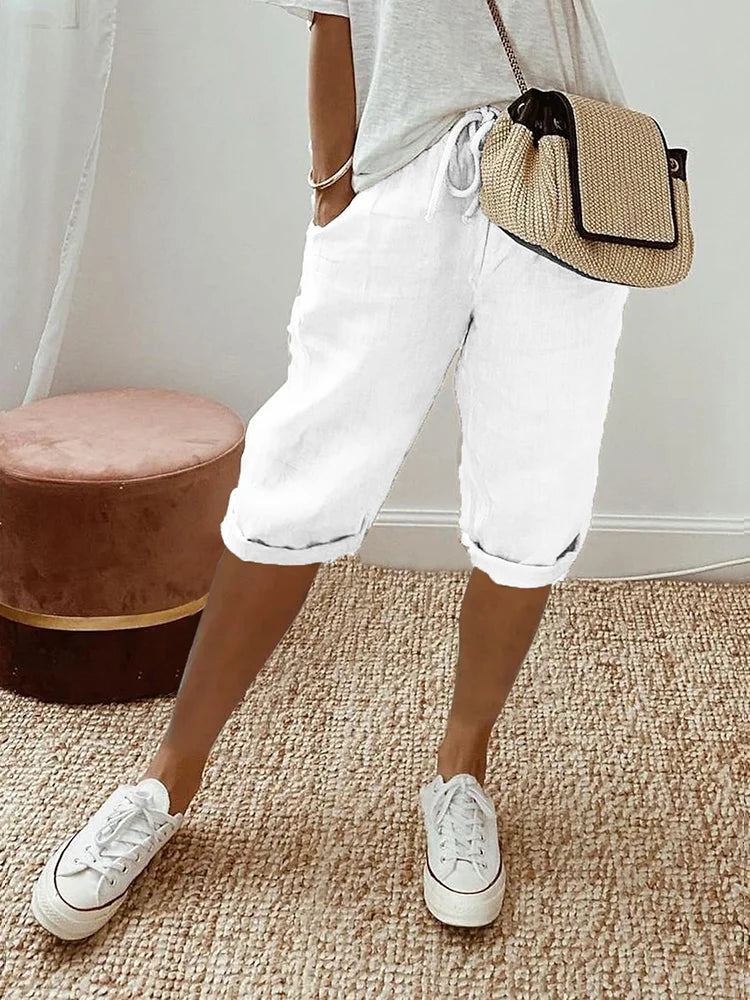 Relaxed fit women's casual shorts for everyday comfort. Features drawstring waist & pockets, great for summer.