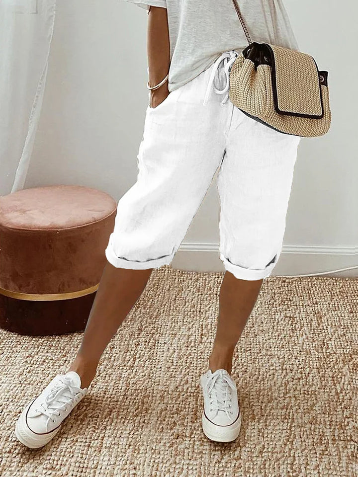 Relaxed fit women's casual shorts for everyday comfort. Features drawstring waist & pockets, great for summer.