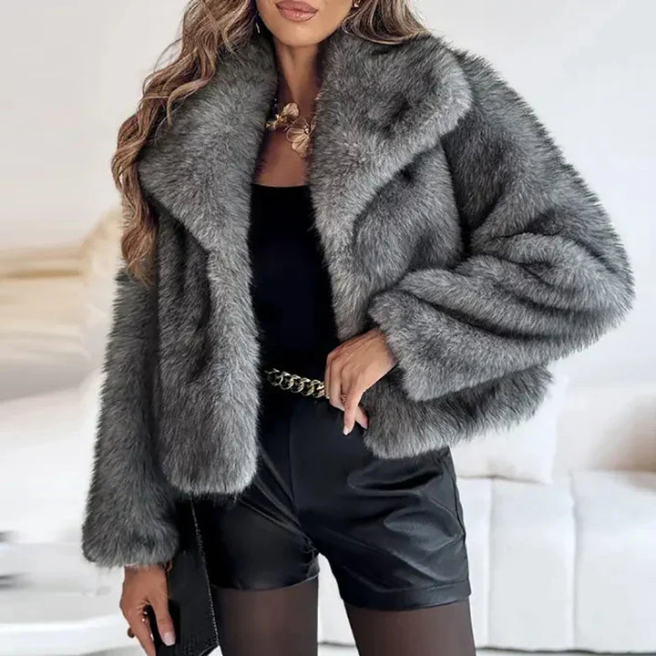 Full-length view of a women's relaxed fit faux fur jacket with stylish lapels, perfect for cold weather.