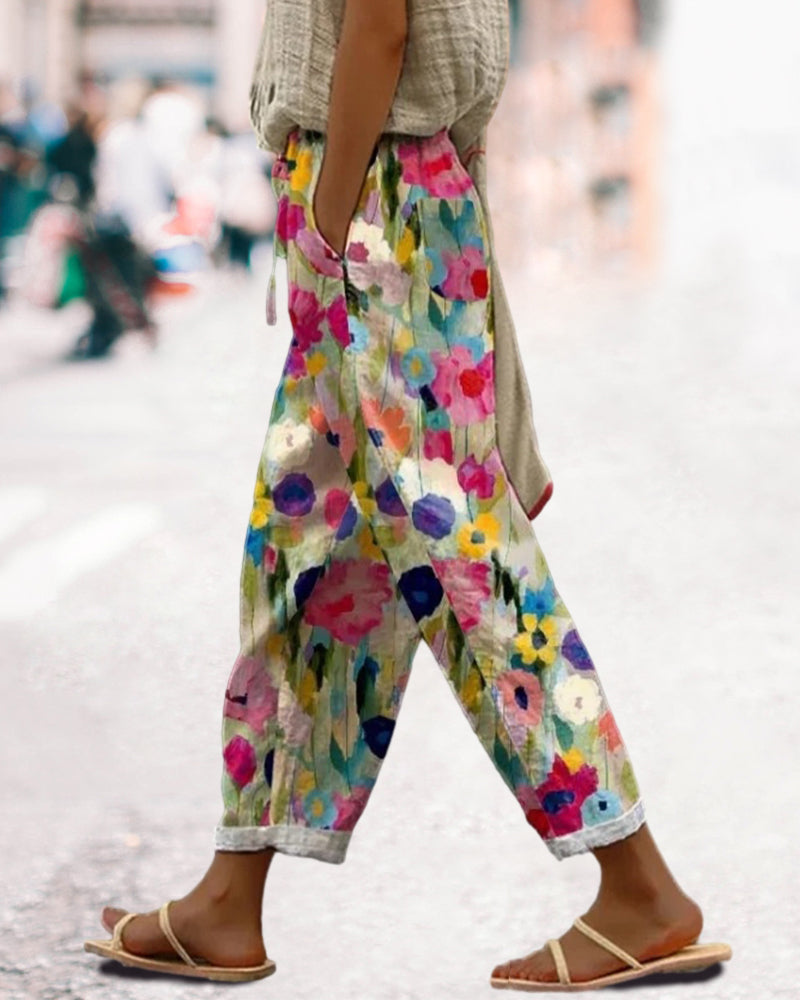 Women's relaxed fit floral print casual trousers. Multicolored boho summer pants for comfortable everyday fashion.