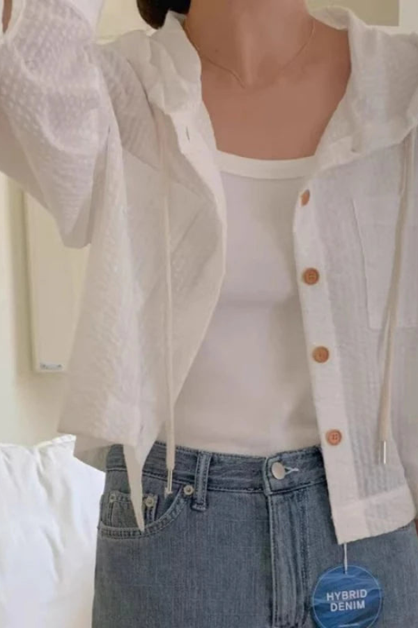 Women's relaxed fit hooded blouse for effortless summer style. Comfortable, long-sleeve casual top.