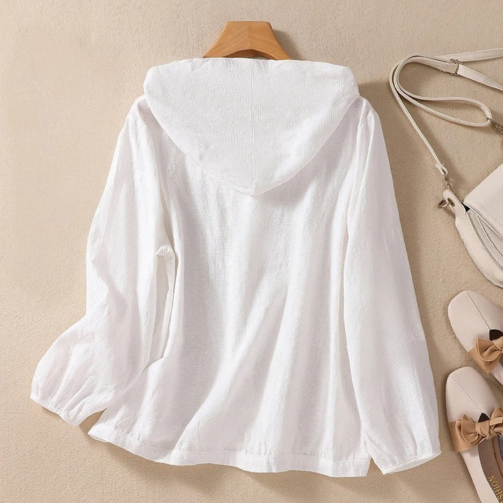 Stylish women's hooded shirt with a relaxed fit, featuring long sleeves for comfortable, casual wear.