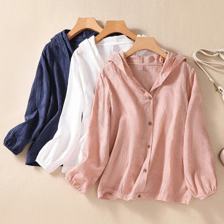 Casual women's relaxed fit hooded blouse for everyday style, offering comfort and a chic look.
