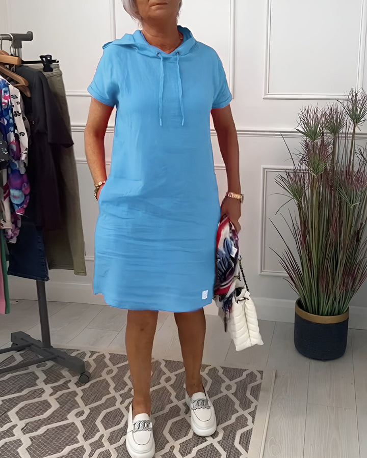 Relaxed fit women's hoodie midi dress, comfortable for summer fashion, featuring an adjustable hood.