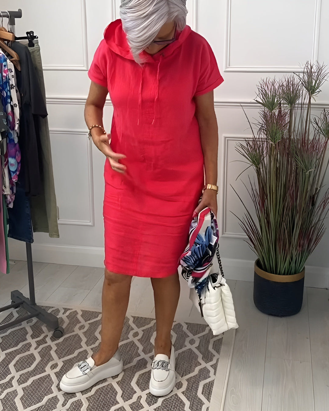 Comfortable women's relaxed fit hoodie midi dress, featuring an adjustable drawstring hood.