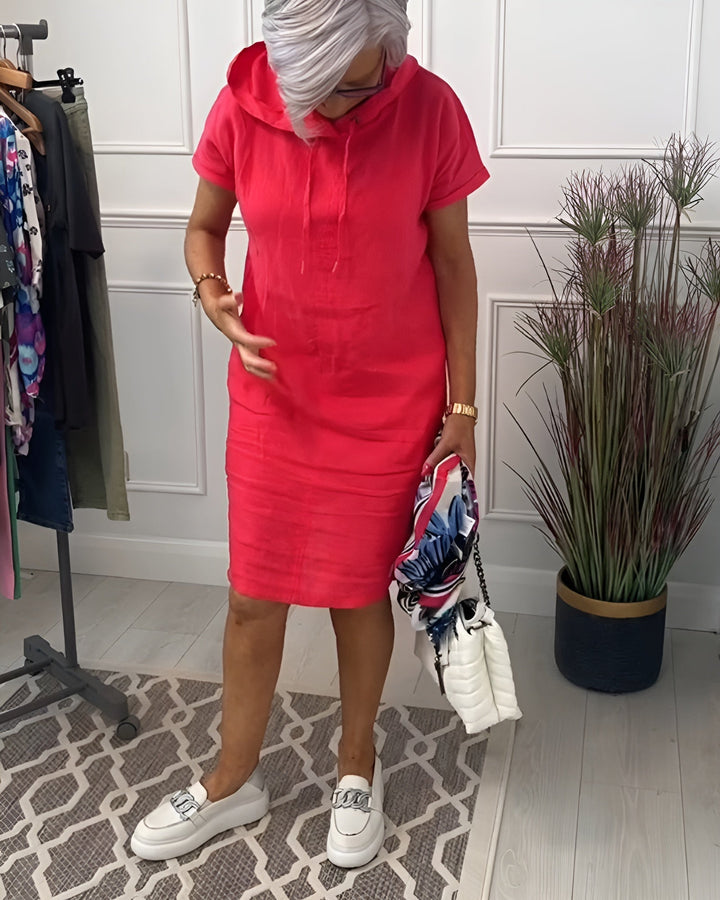 Comfortable women's relaxed fit hoodie midi dress, featuring an adjustable drawstring hood.
