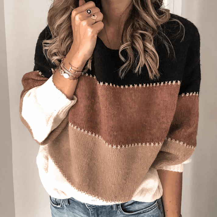 Stylish women's relaxed fit knit sweater with ribbed cuffs. Perfect crew neck long sleeve for everyday wear.