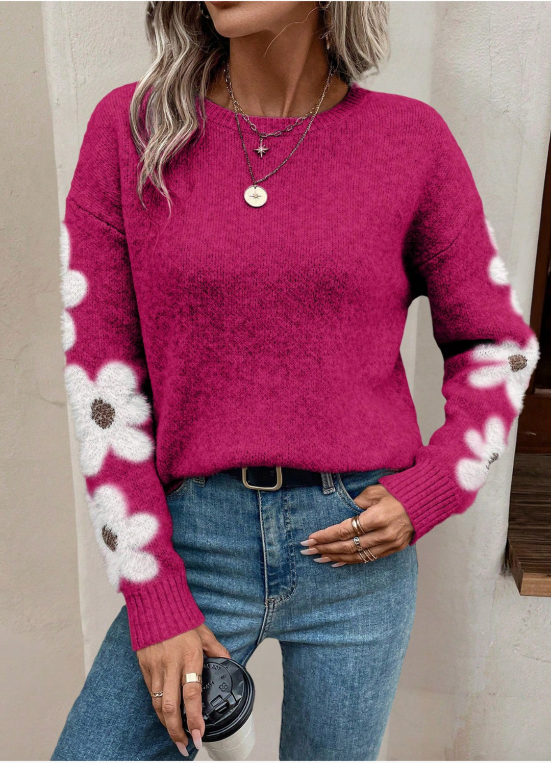 Women's fall fashion: a relaxed knit long sleeve sweater with an adorable daisy print.