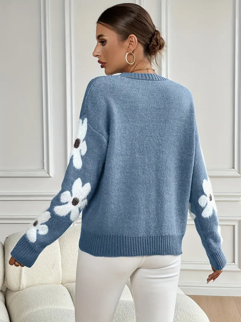 Cream-colored women's knitwear with delicate daisy print, a comfortable and stylish fall top.