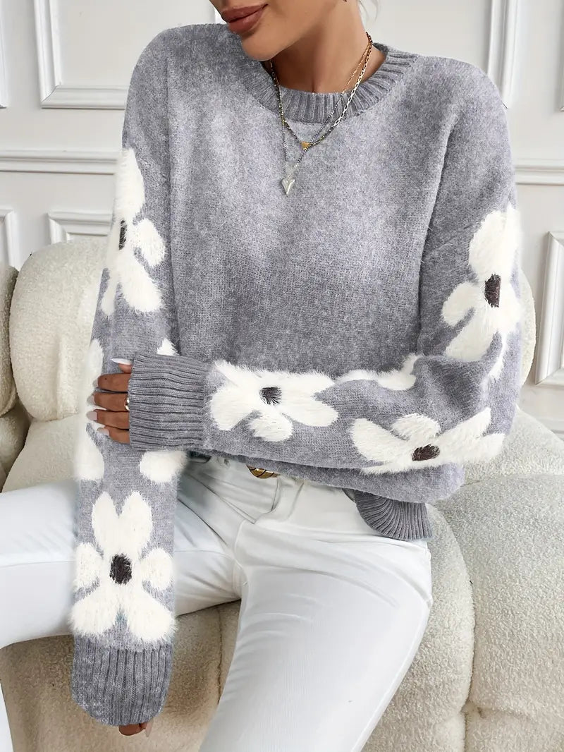 Stylish women's daisy print sweater, a soft and warm addition to any fall and winter wardrobe.