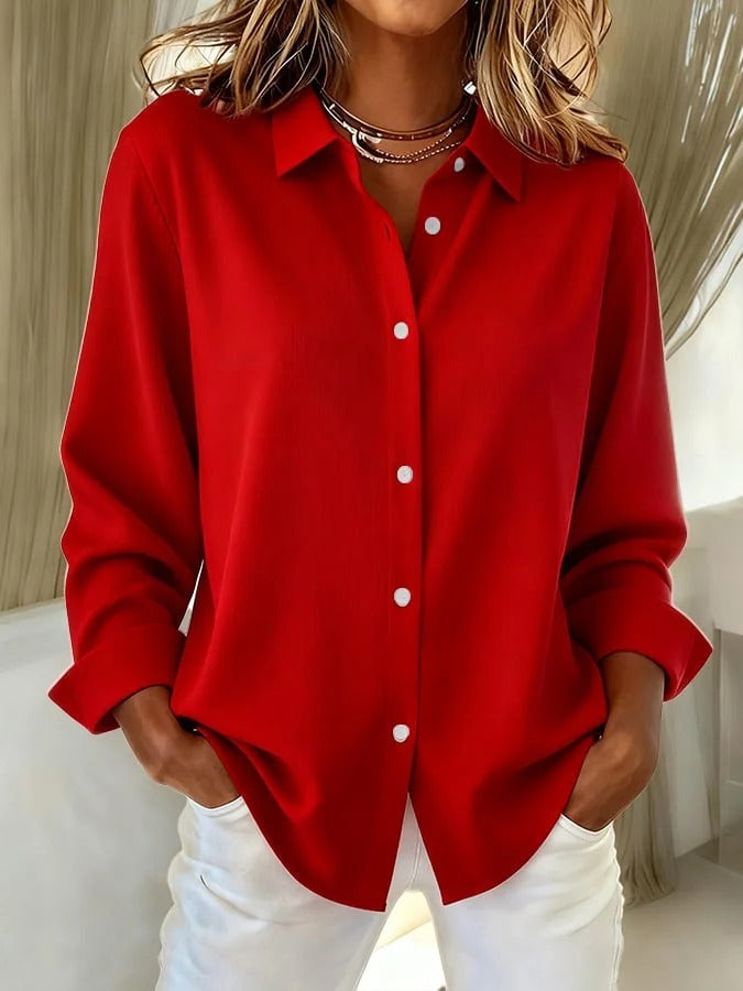 Professional women's office wear blouse, a comfortable relaxed fit long sleeve button-down top for work.
