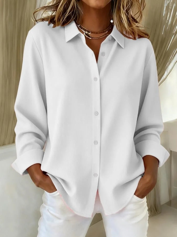 Elegant women's button-down long sleeve blouse with a relaxed fit, perfect for a refined work or casual look.