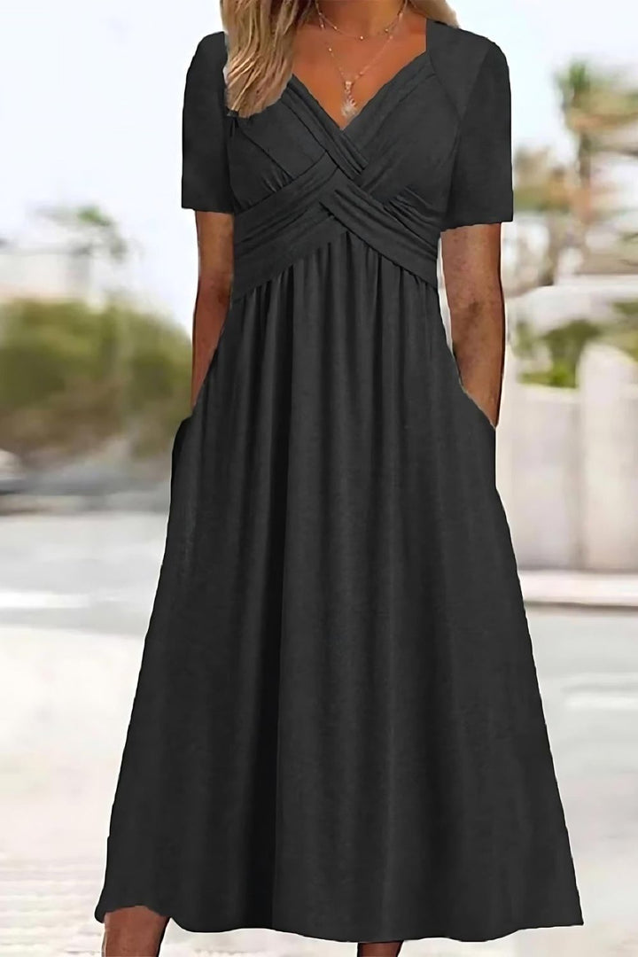 Chic women's printed midi dress with a flowing relaxed fit, ideal for casual outings and effortless spring fashion.