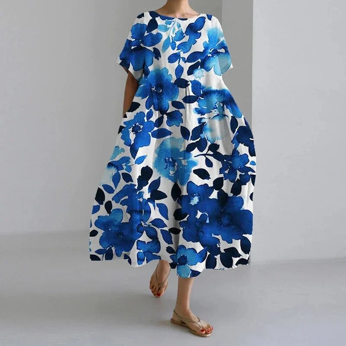 Fashionable women's midi dress with an eye-catching floral print and a relaxed, breezy style.