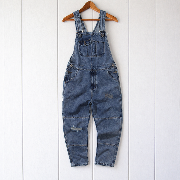 Close-up of women's relaxed fit overalls showing practical utility pockets. Ideal for casual spring & fall fashion.