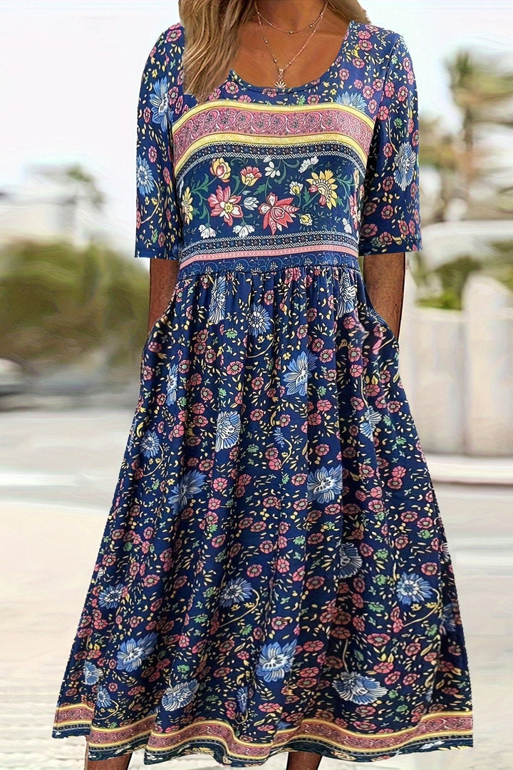 Stylish women's summer midi dress with vibrant print & relaxed, comfortable fit. Elegant everyday fashion.