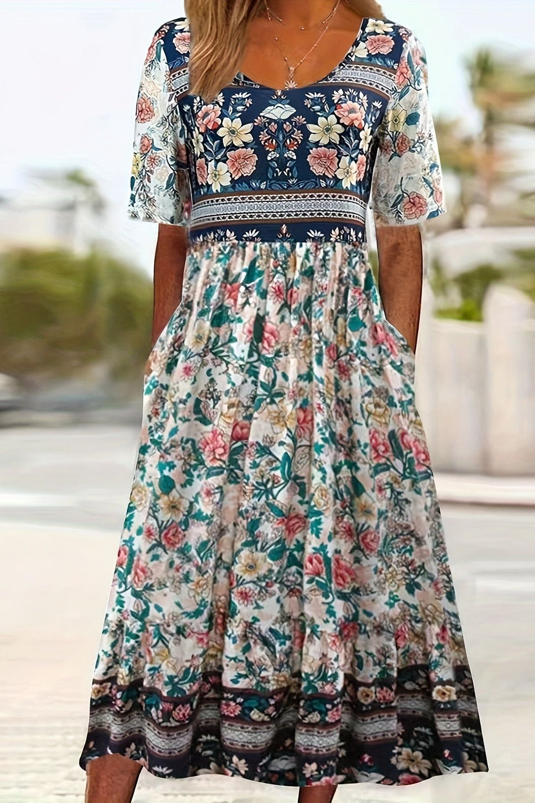 Flowy women's printed midi dress, offering a relaxed fit & comfortable wear. Ideal for versatile summer style.