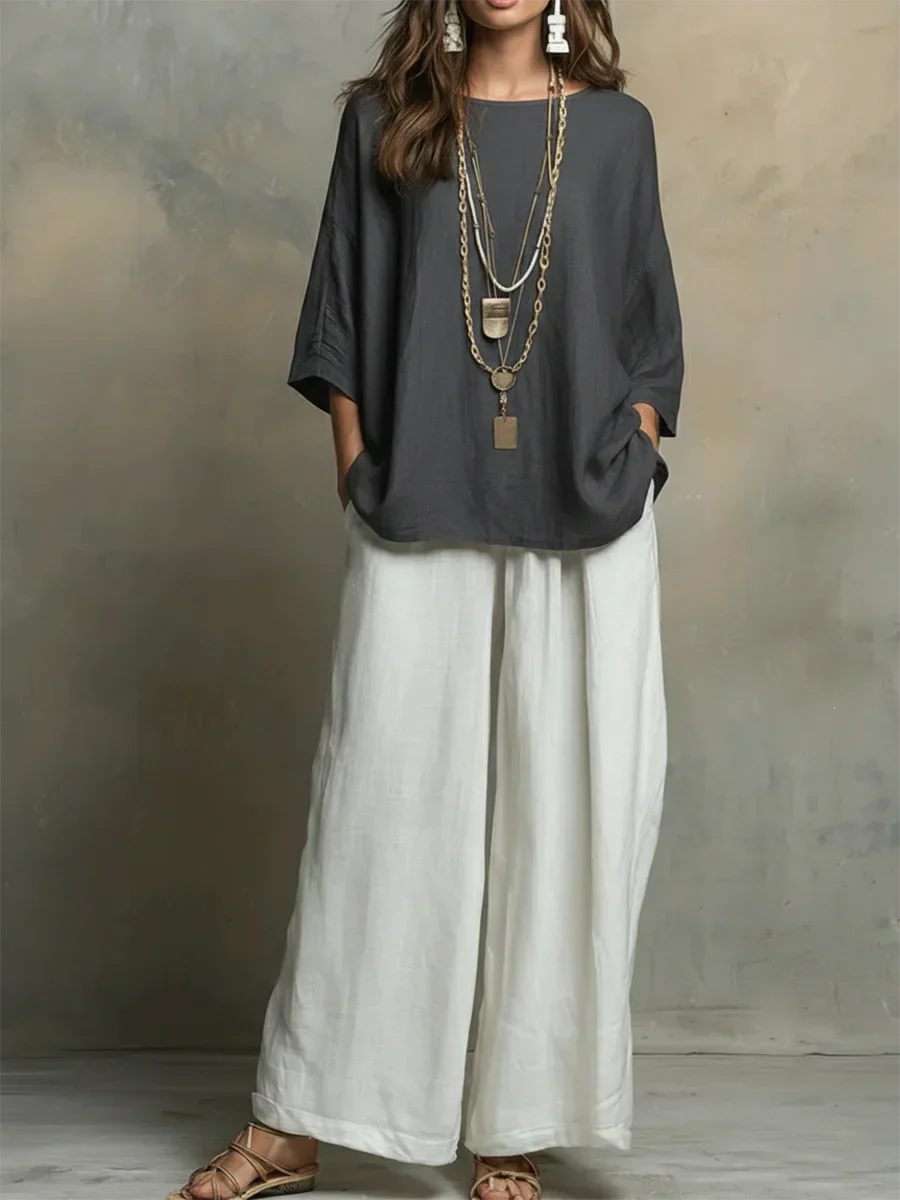 Womens two piece outfit: relaxed fit button-down shirt & wide leg pants. Versatile spring ensemble.