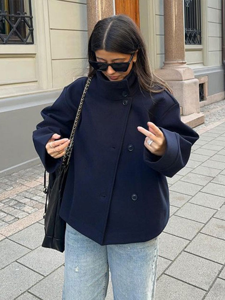 Stylish women's short coat featuring a high neck & practical button closure. Ideal relaxed fit casual outerwear for daily wear.