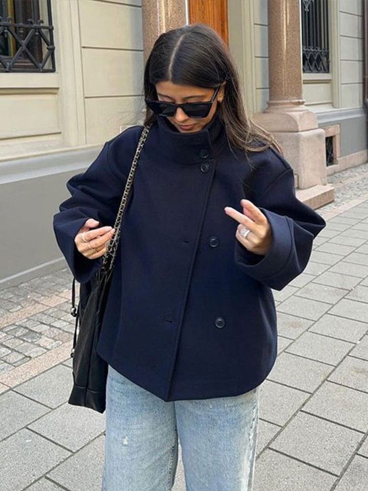 Stylish women's short coat featuring a high neck & practical button closure. Ideal relaxed fit casual outerwear for daily wear.