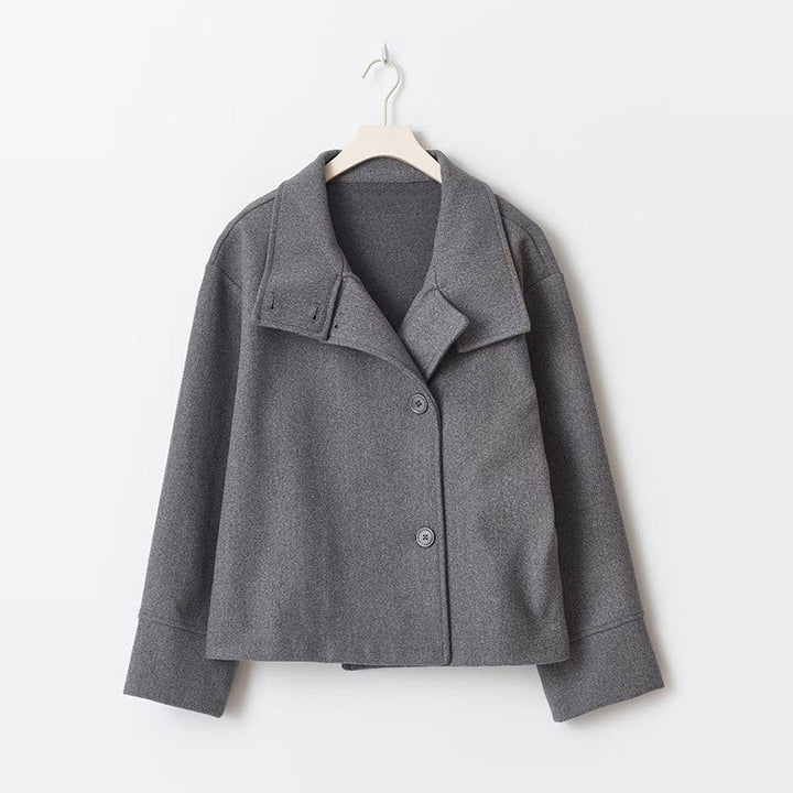 Comfortable women's relaxed fit short coat, perfect for fall fashion. Features a cozy high neck & sleek button closure.