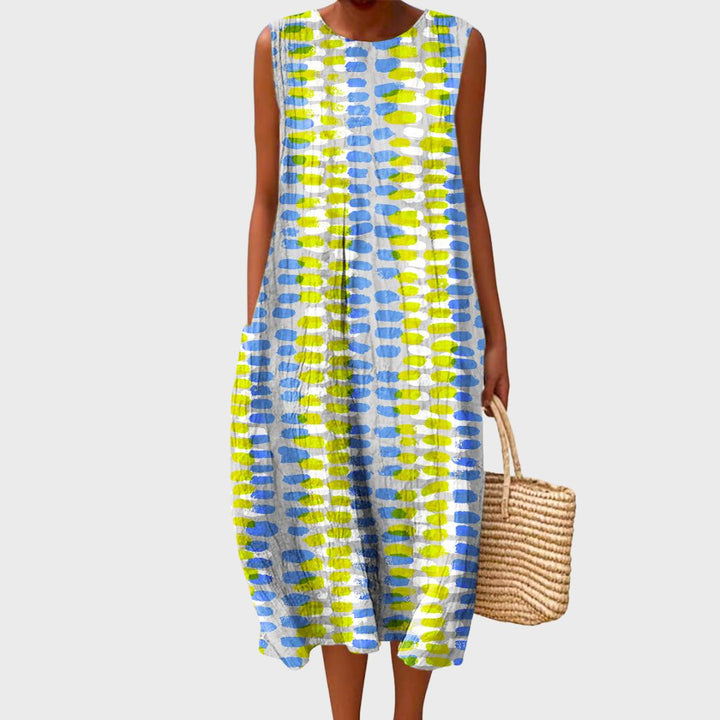 Comfortable women's sleeveless knee-length casual dress with a crew neck and pockets.