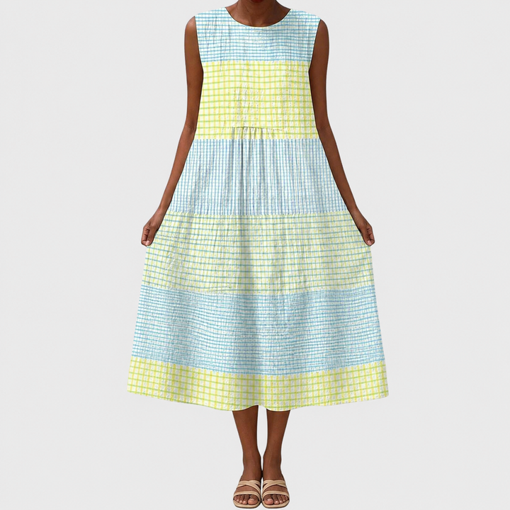 Woman wearing a comfortable relaxed fit sleeveless casual dress, knee-length, ideal for daily activities.