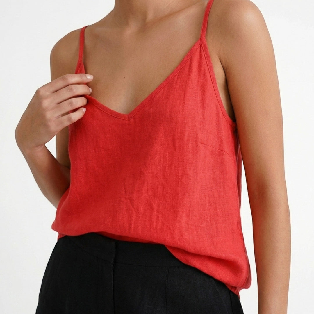 Women's relaxed fit spaghetti strap tank top, a versatile and essential piece for summer wardrobes.