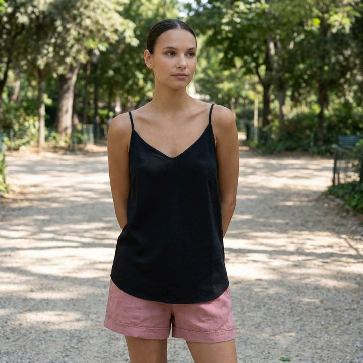 Versatile women's spaghetti strap tank top, ideal for layering or casual summer outfits.