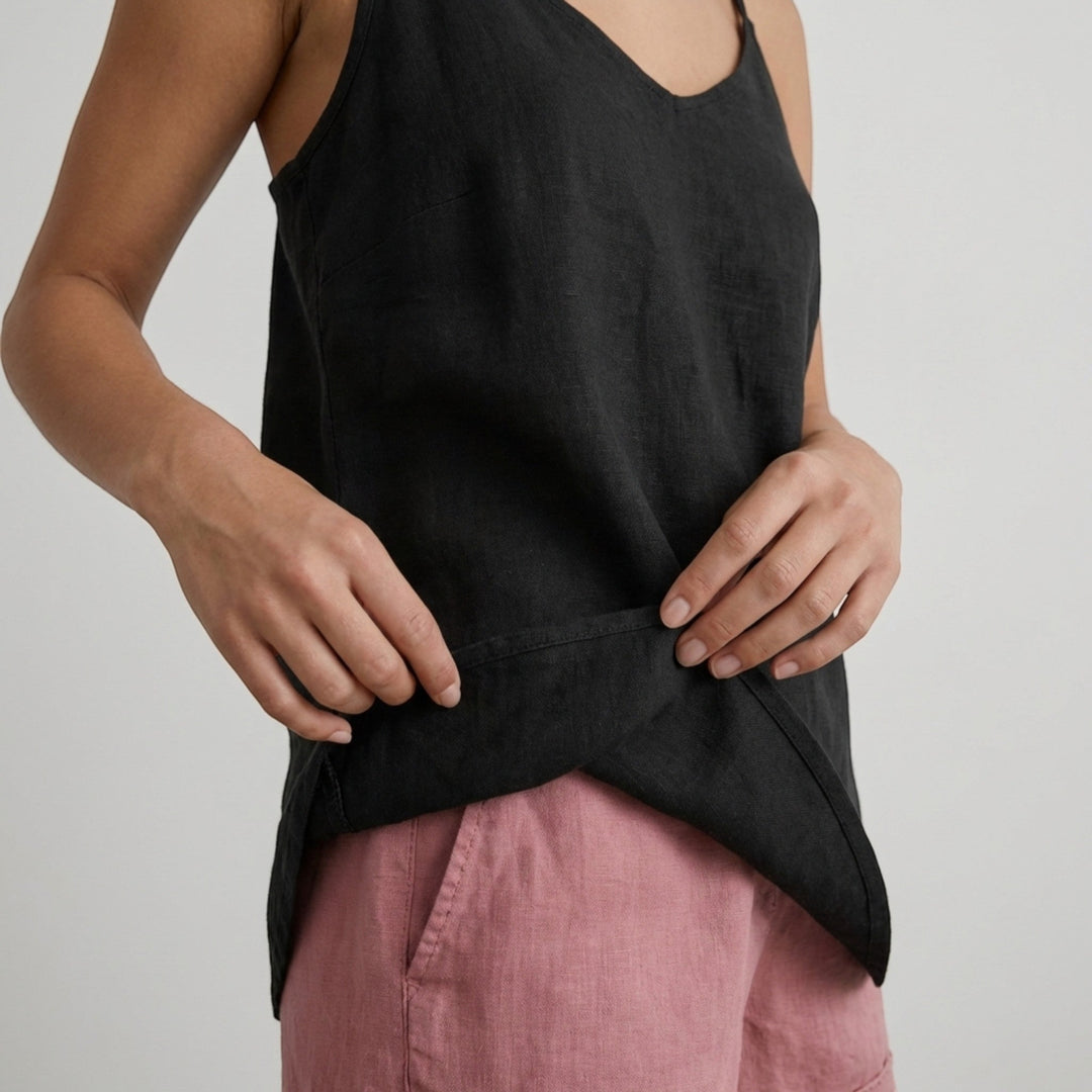 Flowy women's relaxed fit tank top with thin spaghetti straps, perfect for warm weather.