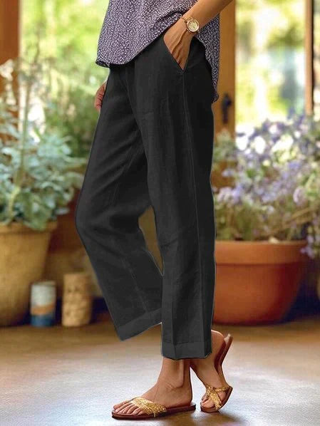 Comfortable women's relaxed fit straight-leg pants, perfect for casual everyday wear with convenient side pockets.