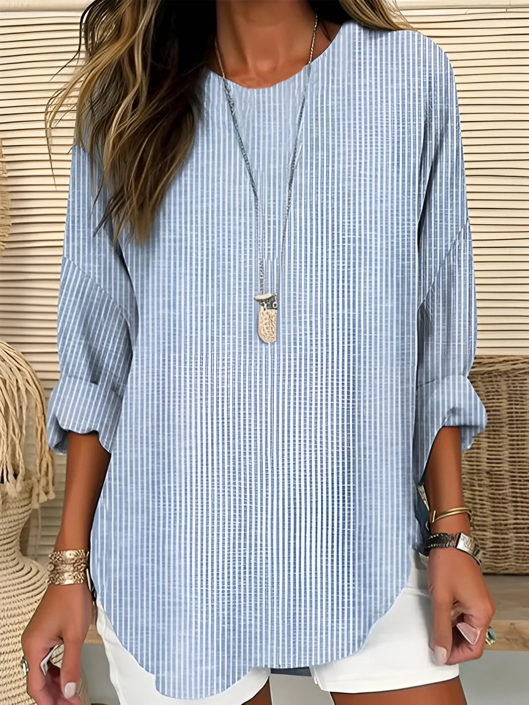 Women's relaxed fit striped long sleeve blouse with a round neck, perfect for casual everyday comfort and versatile styling.